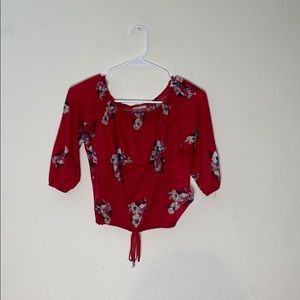 Crop top with flowers and a knot on the bottom